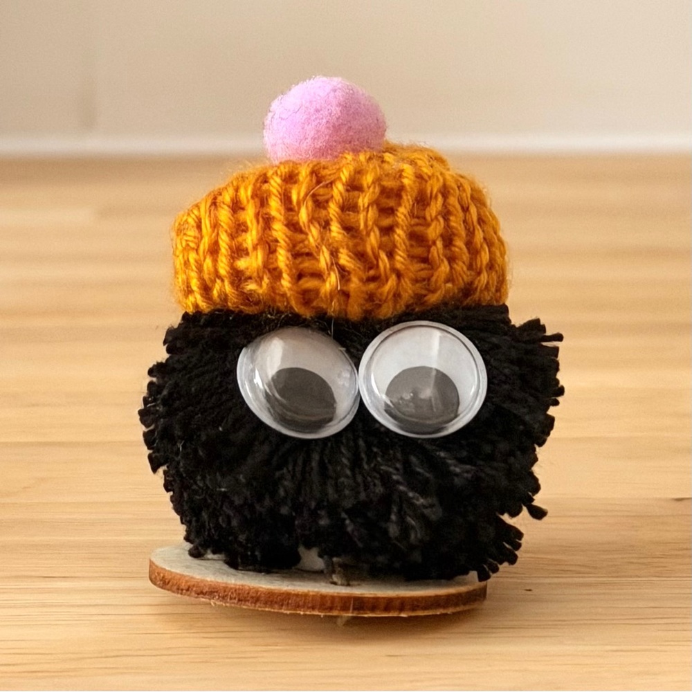 Handmade Black Pom Pom with Orange Hat - “Poppy Pop”- PomPeeps Collection OOAK